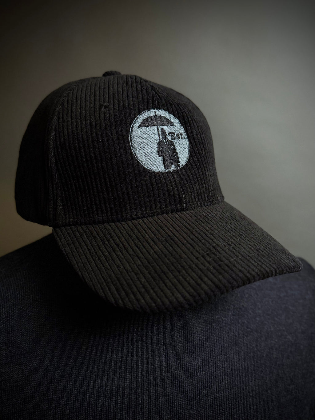 Corduroy Baseball Cap. Black/Grey Logo.