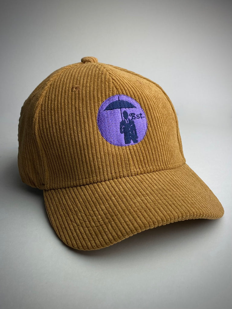 Corduroy Baseball Cap. Tobacco/Lilac Logo.